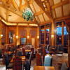 large log trusses above dining room